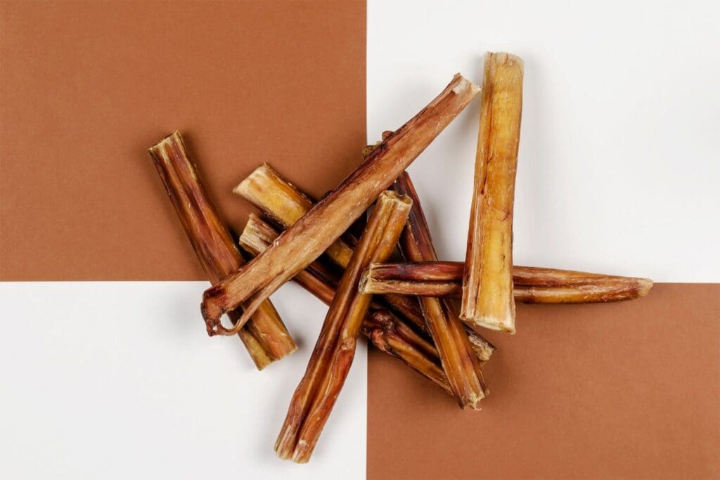 bully sticks on a brown and white background